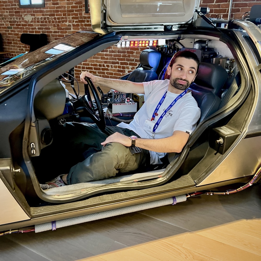 Orazio Rillo sitting in a DeLorean